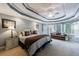 Spacious main bedroom with a tray ceiling, recessed lighting, a ceiling fan and lots of windows at 265 Dogwood Walk Ln, Norcross, GA 30071