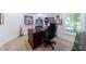 Well-lit home office with a large desk, comfortable chair, and ample space for productivity at 265 Dogwood Walk Ln, Norcross, GA 30071