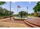 The fountain at Lillian Webb Park is surrounded by brick pavers, benches, and flags at 265 Dogwood Walk Ln, Norcross, GA 30071