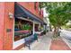 Piazanos Pizza Kitchen features a black awning, string lights, and outdoor seating at 265 Dogwood Walk Ln, Norcross, GA 30071