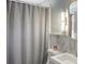 Bright bathroom featuring a light-colored shower curtain, sink and vanity with vanity lighting at 3330 W Shadowlawn Ne Ave, Atlanta, GA 30305