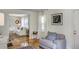 Bright living room featuring hardwood floors, white trim and comfortable seating with a view to another seating area at 3330 W Shadowlawn Ne Ave, Atlanta, GA 30305