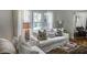 Cozy living room with white sofas, decorative pillows, hardwood floors and a large window at 3330 W Shadowlawn Ne Ave, Atlanta, GA 30305