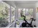 Bright workout room with a Peloton bike and large windows offering natural light and an outdoor view at 3330 W Shadowlawn Ne Ave, Atlanta, GA 30305