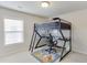 This bedroom features a lofted bed over a desk with a window for plenty of natural light at 4650 Silver Meadow Dr, Buford, GA 30519