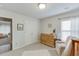 Bright Bedroom with natural light, a wooden changing table and a view into another bedroom at 4650 Silver Meadow Dr, Buford, GA 30519