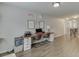 Spacious room with wood floor, decorations and window with natural light at 4650 Silver Meadow Dr, Buford, GA 30519