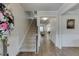 Inviting foyer with hardwood floors, a staircase, and elegant molding throughout the entryway at 4650 Silver Meadow Dr, Buford, GA 30519