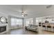 Open concept living room featuring a fireplace and seamless flow into kitchen at 4650 Silver Meadow Dr, Buford, GA 30519