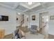 Open-concept living area featuring hardwood floors, modern decor, and ample natural light at 4650 Silver Meadow Dr, Buford, GA 30519