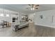 Open-concept living room showcases hardwood floors and a seamless flow to the kitchen and dining area at 4650 Silver Meadow Dr, Buford, GA 30519