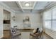Bright living room with coffered ceilings, stylish decor, and large window for natural light at 4650 Silver Meadow Dr, Buford, GA 30519