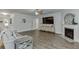 Spacious living room with fireplace, large TV, and neutral decor at 4650 Silver Meadow Dr, Buford, GA 30519