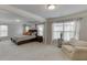 This spacious main bedroom features a sitting area and plenty of natural light at 4650 Silver Meadow Dr, Buford, GA 30519