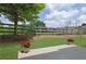 Peaceful backyard featuring a well-maintained lawn, mature tree, a wooden fence and flower pots at 1929 Brightleaf Way, Marietta, GA 30060