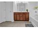 Bathroom featuring a dual sink vanity with ample storage space and a full tub at 1929 Brightleaf Way, Marietta, GA 30060