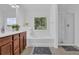Bathroom featuring tub, shower, and vanity, with neutral paint and natural light at 1929 Brightleaf Way, Marietta, GA 30060