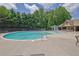 Large community pool with water features, lounge chairs, and shaded pavilion for relaxation and enjoyment at 1929 Brightleaf Way, Marietta, GA 30060