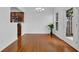 Open dining room area showcasing hardwood floors, a glass door to the backyard, and kitchen access at 1929 Brightleaf Way, Marietta, GA 30060