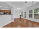 Open dining room adjacent to the kitchen with hardwood floors and a view to the backyard at 1929 Brightleaf Way, Marietta, GA 30060