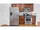 Well-equipped kitchen with stainless steel appliances, wooden cabinets, and granite countertops at 1929 Brightleaf Way, Marietta, GA 30060