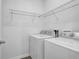 Functional laundry room with appliances and shelving for organization at 1929 Brightleaf Way, Marietta, GA 30060