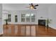 Bright living room with a fireplace, a ceiling fan, and large windows offering plenty of natural light at 1929 Brightleaf Way, Marietta, GA 30060