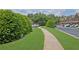 Community walkway lined with manicured greenery, offering a serene and inviting path for residents at 1929 Brightleaf Way, Marietta, GA 30060