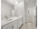 Bright bathroom features double vanity with quartz countertop, sleek faucets, and tile flooring at 22 Foothills Trl, Sharpsburg, GA 30277