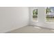 Bright bedroom with two large windows overlooking the green trees and neighborhood at 22 Foothills Trl, Sharpsburg, GA 30277