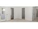 Bedroom with doors leading to a closet, bathroom, and outside porch at 22 Foothills Trl, Sharpsburg, GA 30277