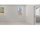 Bedroom with windows and door leading to a patio space outside at 22 Foothills Trl, Sharpsburg, GA 30277