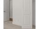 Bedroom boasts neutral carpet, white doors, and glimpse of wood floors at 22 Foothills Trl, Sharpsburg, GA 30277