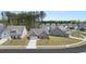 Beautiful single Gathering home with a manicured front lawn in a suburban neighborhood at 22 Foothills Trl, Sharpsburg, GA 30277