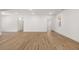 Spacious living area with wood-look floors and a neutral color palette at 22 Foothills Trl, Sharpsburg, GA 30277