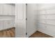 Walk-in pantry featuring white wire shelving for optimal storage at 22 Foothills Trl, Sharpsburg, GA 30277