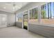 Covered patio with views of the wooded backyard and ceiling fan at 22 Foothills Trl, Sharpsburg, GA 30277