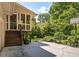 Back of house features a screened in porch with stairs leading to a patio area, with a basketball hoop at 320 Kirk Rd, Decatur, GA 30030