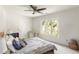 Bedroom with ceiling fan, large windows, and a comfortable bed at 320 Kirk Rd, Decatur, GA 30030