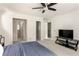 Spacious bedroom with black media stand and access to additional rooms at 320 Kirk Rd, Decatur, GA 30030
