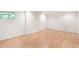 A bright bedroom featuring wood laminate flooring, recessed lighting, and a window at 320 Kirk Rd, Decatur, GA 30030