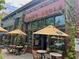 Outside view of the Brick Store Pub featuring patio furniture and large windows at 320 Kirk Rd, Decatur, GA 30030