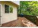 Large wood deck with outdoor grill and scenic views of surrounding trees at 320 Kirk Rd, Decatur, GA 30030