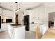 Spacious kitchen with white cabinets, granite countertops, stainless steel appliances and kitchen island with gas cooktop at 320 Kirk Rd, Decatur, GA 30030