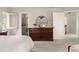 Serene main bedroom with a ceiling fan, dresser, and ensuite bathroom entrance at 320 Kirk Rd, Decatur, GA 30030