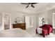 Comfortable main bedroom featuring a ceiling fan, sitting area, and neutral decor at 320 Kirk Rd, Decatur, GA 30030