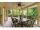 Inviting screened-in patio featuring a ceiling fan and an outdoor dining area at 320 Kirk Rd, Decatur, GA 30030