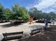 Outdoor common area featuring benches, public art, and shade trees at 320 Kirk Rd, Decatur, GA 30030