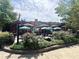 Restaurant featuring outdoor patio with umbrellas, landscaping, and ample seating at 320 Kirk Rd, Decatur, GA 30030