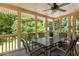 Enclosed porch features a ceiling fan, multiple chairs and dining table providing an enjoyable outdoor setting at 320 Kirk Rd, Decatur, GA 30030